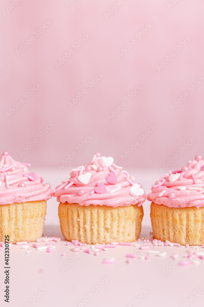 homemade vanilla cupcakes with pink buttercream frosting and heart sprinkles homemade vanilla cupcakes with pink buttercream frosting and heart sprinkles