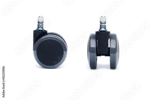 Two furniture castor wheel for office chair isolated on white background. Close-up view photo