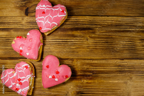 Heart shaped cookies on wooden table. Top view, copy space. Dessert for Valentine day