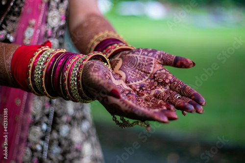 Indian Hindu bride's wedding henna mehendi menhdi hands close up