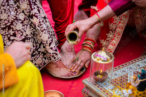 Indian Hindu couple's feet close up, wedding ceremony, religious items and rituals, pooja
