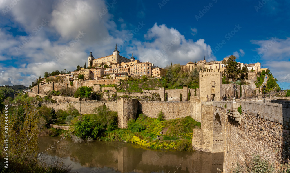 City View of Toledo at Alcantara Bridgehead by the Tagus River bank in Toledo, Spain.