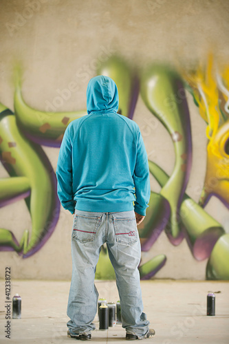 Graffiti artist painting photo