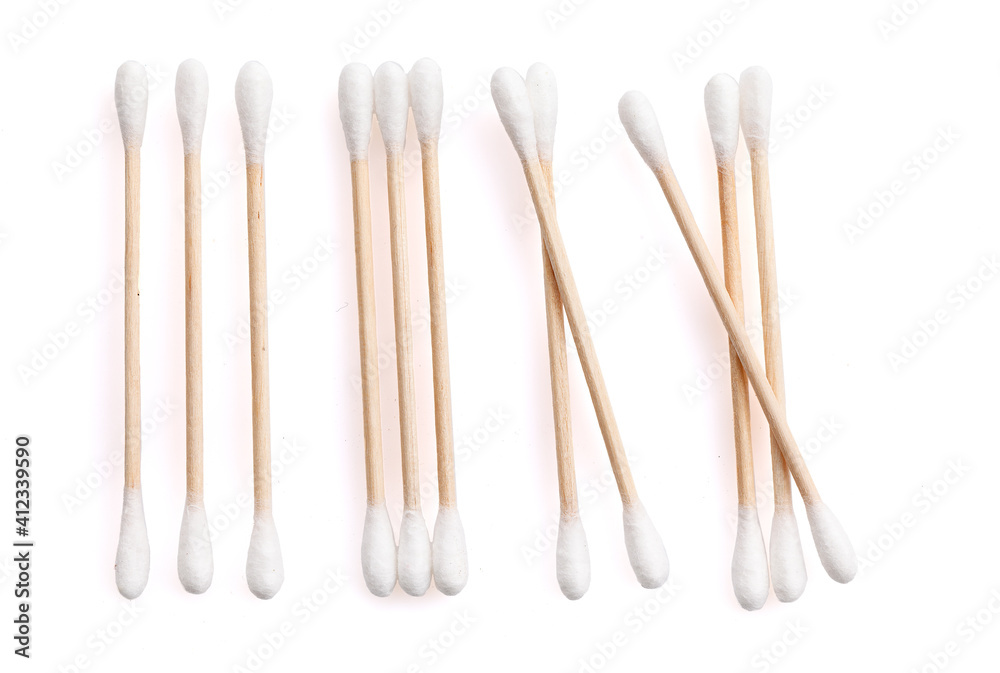 Eco-friendly materials. Wooden, cotton swabs on a white background. Close-up. Eco-friendly materials. Wooden, cotton swabs on a white background. Close-up.