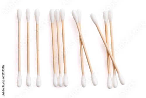 Eco-friendly materials. Wooden, cotton swabs on a white background. Close-up.