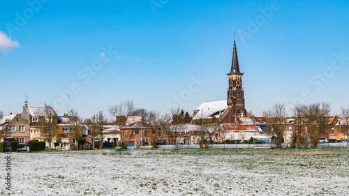 Winter view of the Saint-Gérard church and the Wattrelos district of Touquet-Saint-Gérard in France. Department Nord-Pas-de-Calais. © mimpki