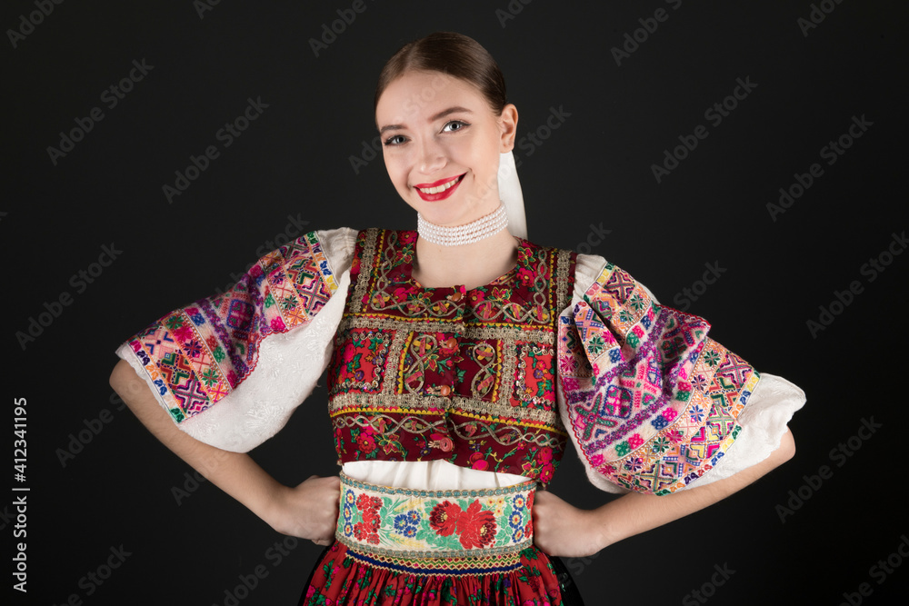 Young beautiful slovak woman in traditional dress. Slovak folklore Young beautiful slovak woman in traditional dress. Slovak folklore