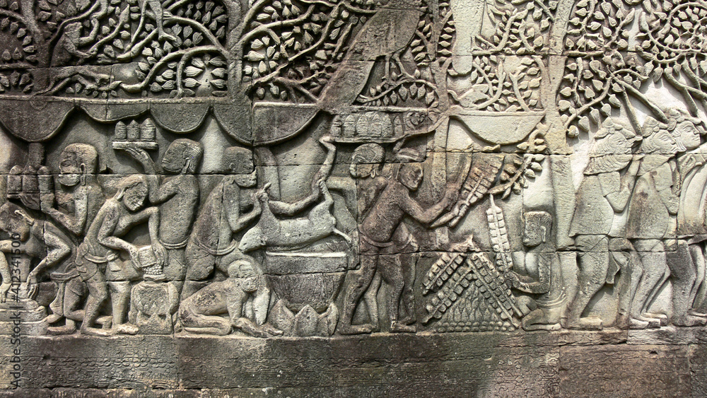 Ancient Khmers making food in reliefs in Angkor, Cambodia