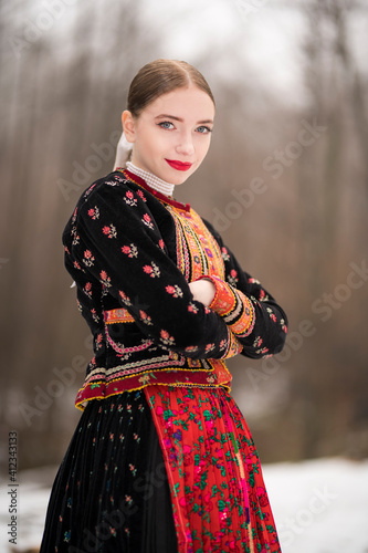 Young beautiful slovak woman in traditional dress. Slovak folklore