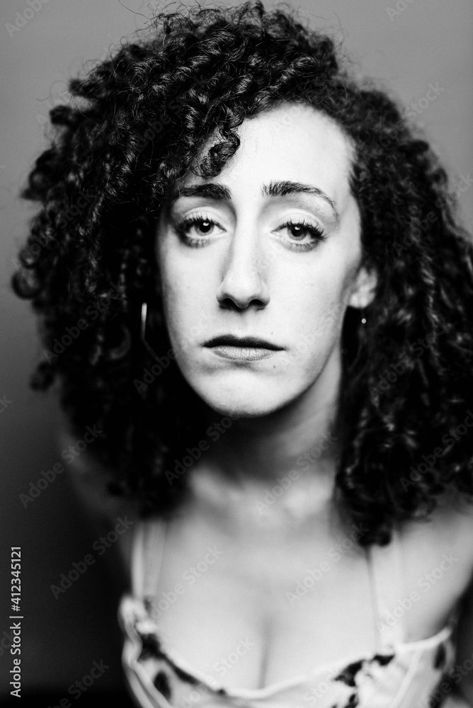 Woman in make up and dress expressing pensive sadness Woman in make up and dress expressing pensive sadness