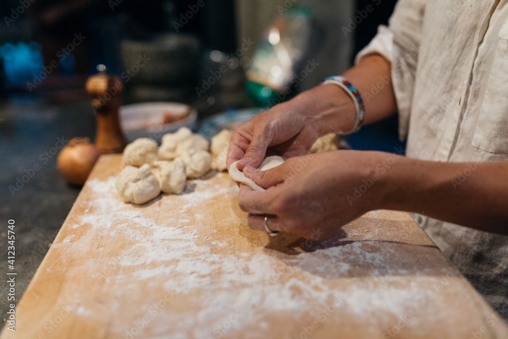 Female cooking in trendy kitchen Female cooking in trendy kitchen