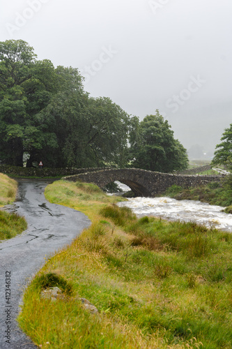 river in the fields with a bridge