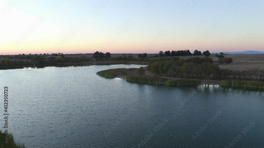 Lake drone aerial view at sunset in Alentejo, Portugal Lake drone aerial view at sunset in Alentejo, Portugal