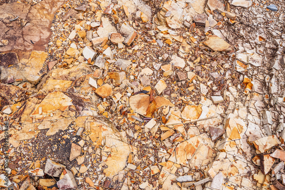 Sedimentary rock. Sedimentary rocks broken on pieces on the ground. Sedimentary rock. Sedimentary rocks broken on pieces on the ground.