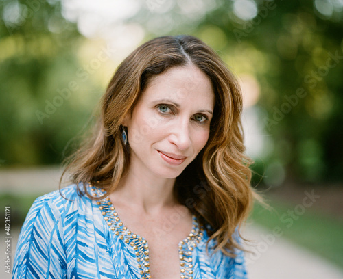Portrait of a beautiful woman in a blue top