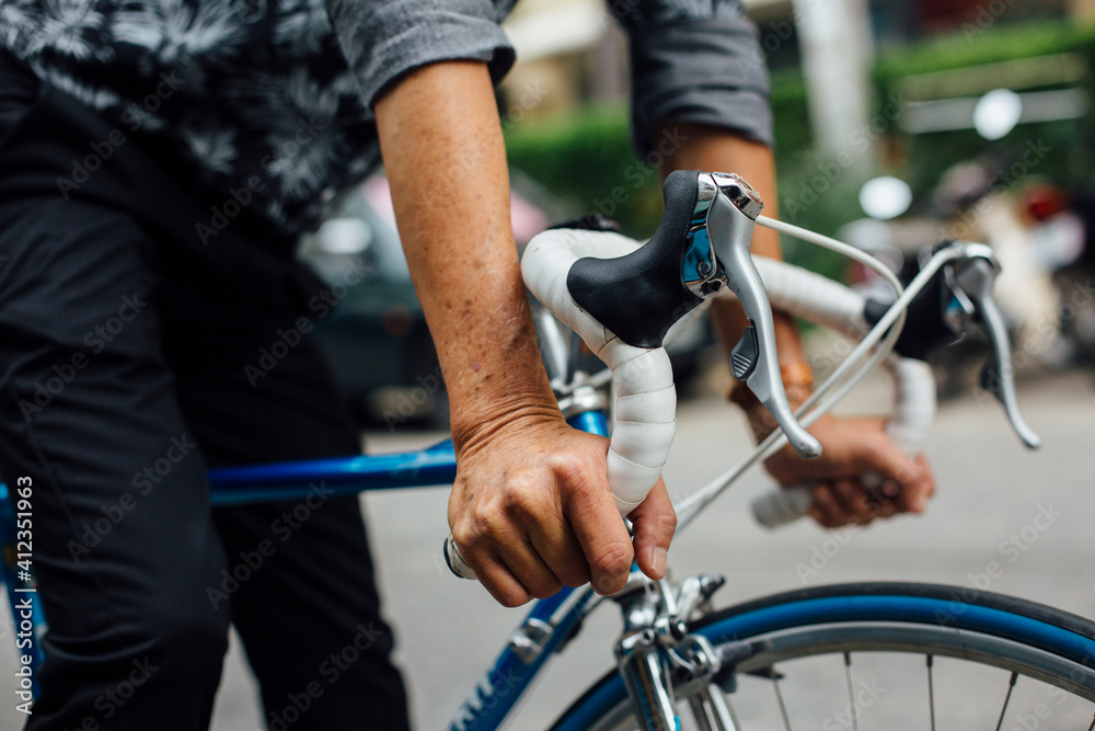 Senior asian man with road bicycle Senior asian man with road bicycle