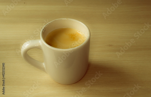 A coffee mug with coffee and milk