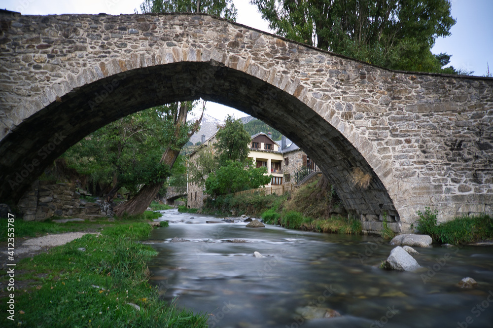 Stone bridge in Sallent de Gallego town, located in Hueca, Aragon, Spain.