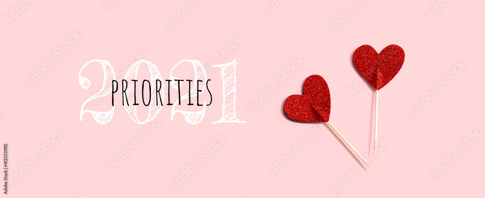 Priorities 2021 concept with red glitter heart picks - flat lay