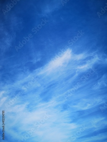 blue sky with feathery white clouds nature