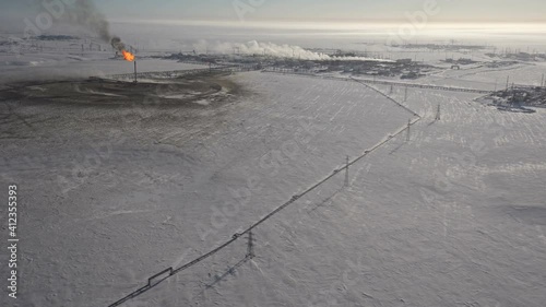 Torch in an oil field. Winter. Aerial view.