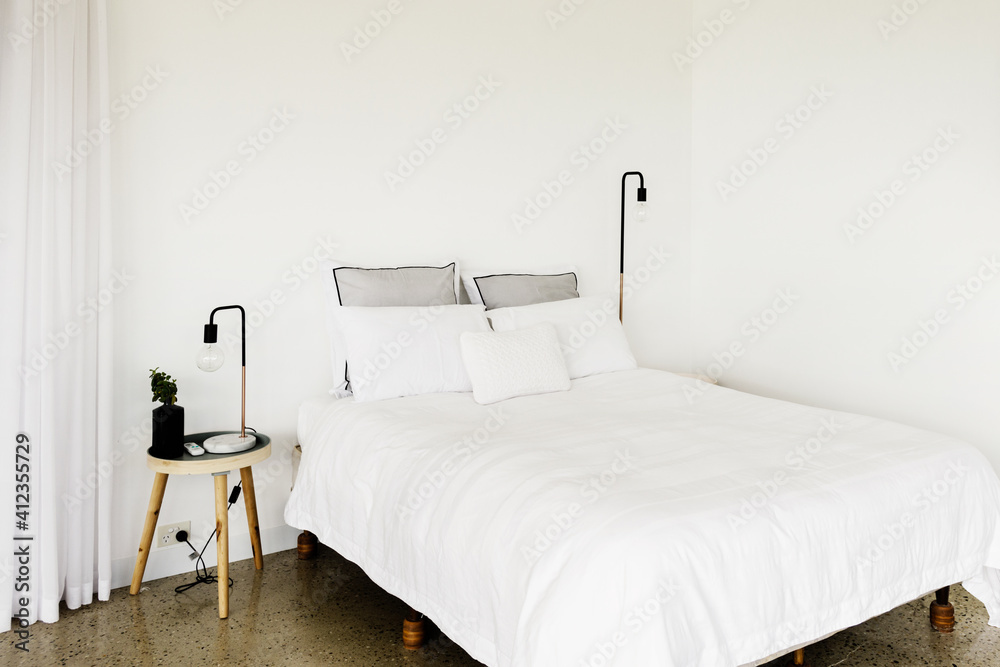 white bedrrom with modern danish style bedside table and blank w white bedrrom with modern danish style bedside table and blank w