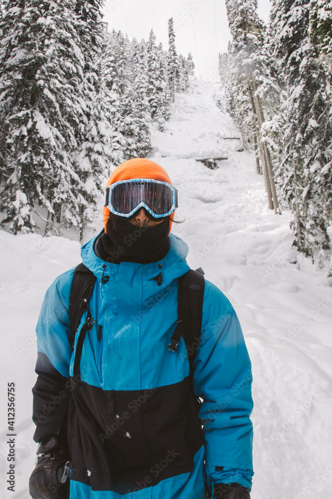 Skier portrait with off piste run and trees on the background. Freeride ski Skier portrait with off piste run and trees on the background. Freeride ski