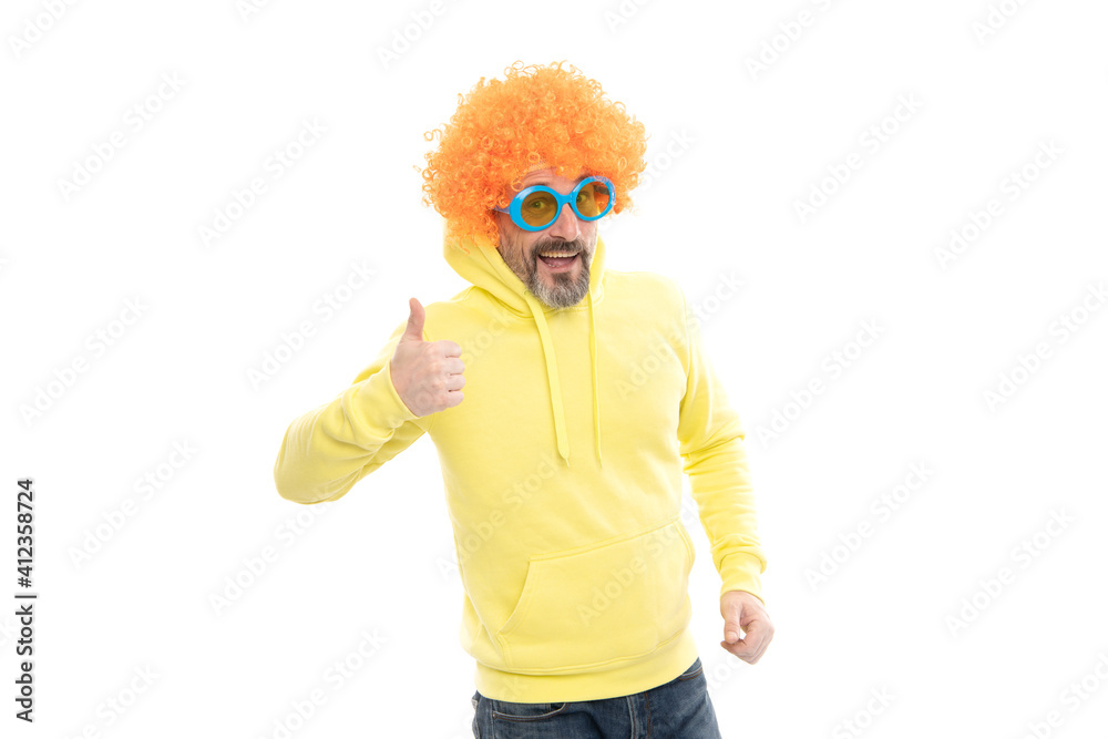 Funny man wear funky wig hair with party sunglasses showing thumbs up hand gesture, approval Funny man wear funky wig hair with party sunglasses showing thumbs up hand gesture, approval
