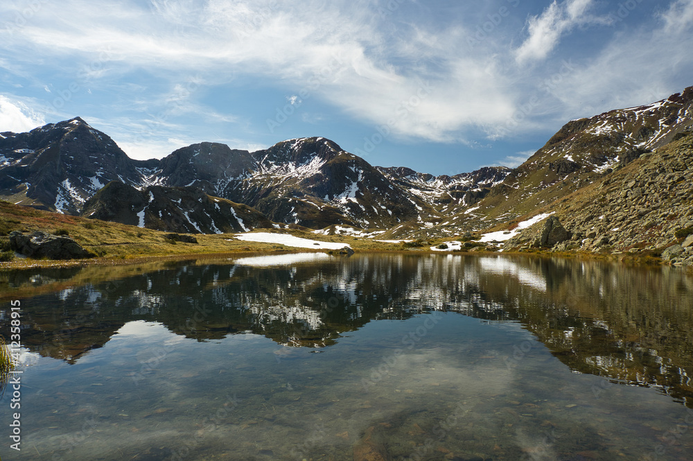 Ibon de Anayet and the Portalet with the bottom the Anayet peak. Concept famous mountains of the Aragonese Pyrenees