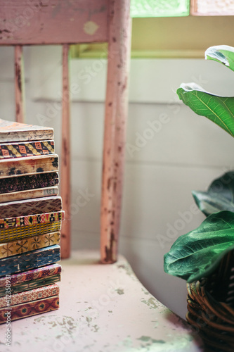 Old Books stacked on Chair photo