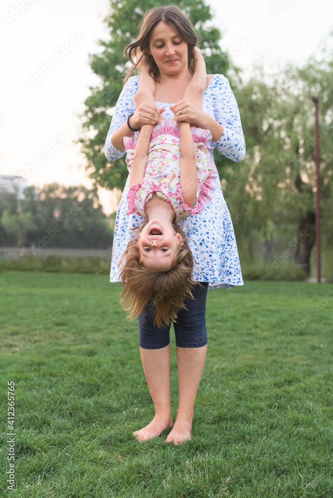 Mother and daughter having fun outdoor in the park Mother and daughter having fun outdoor in the park