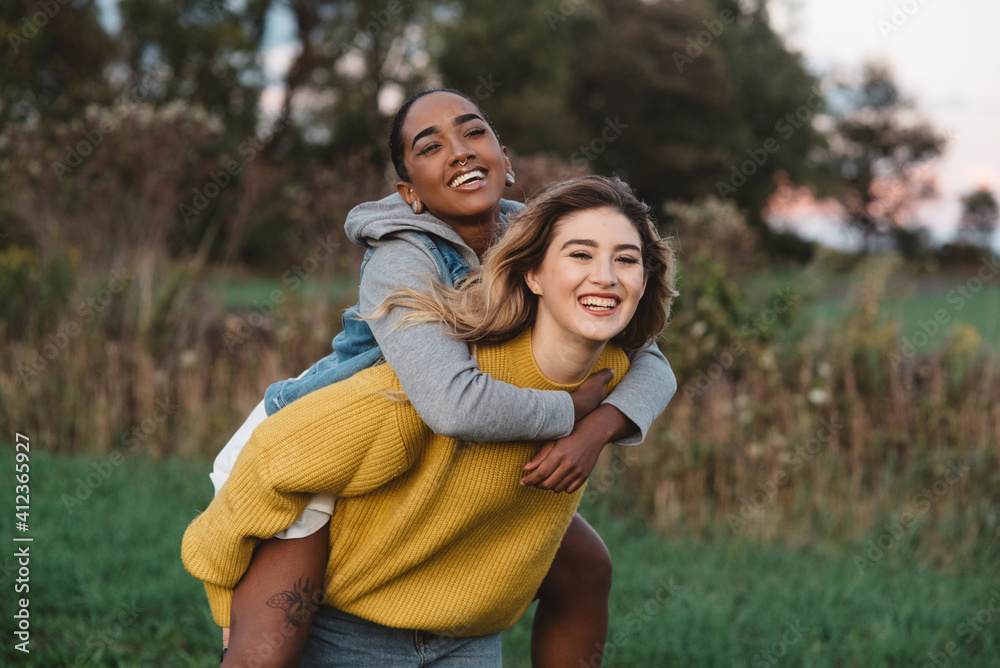 Two young friends in their twenties at a pumpkin patch Two young friends in their twenties at a pumpkin patch