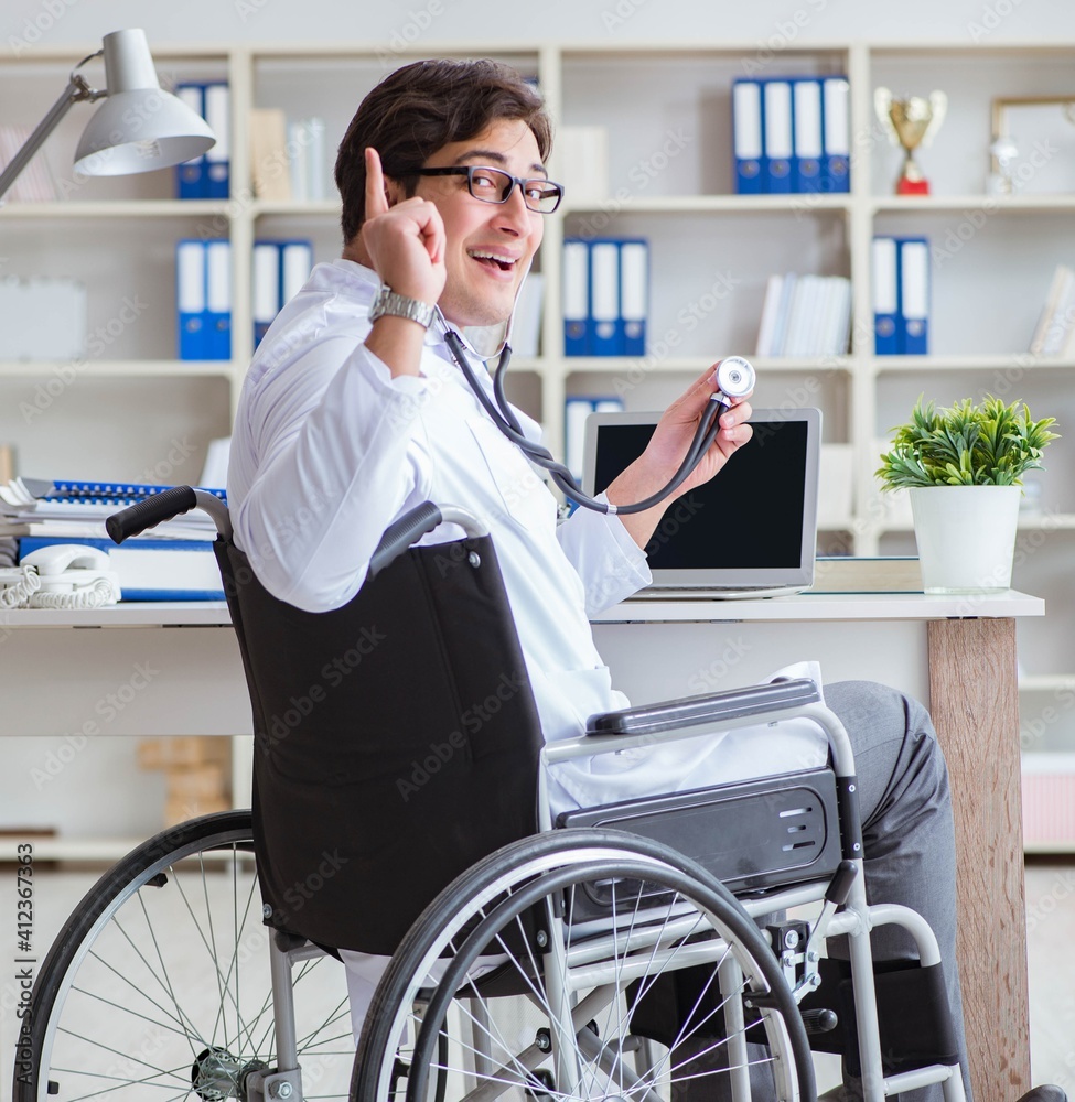 Disabled doctor on wheelchair working in hospital Disabled doctor on wheelchair working in hospital