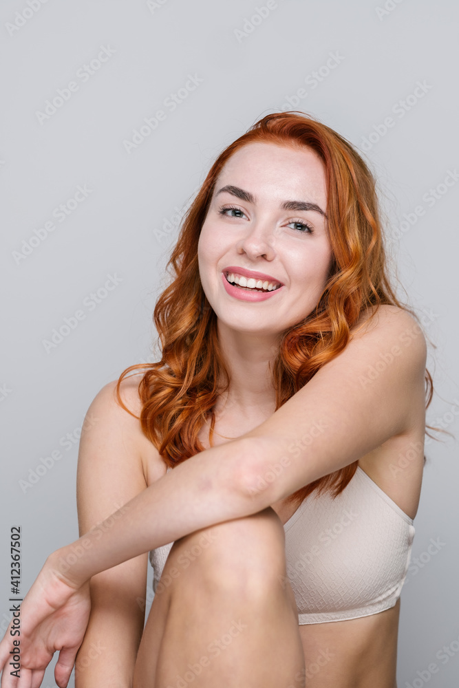 Studio Portrait Of Smiling Redhead Woman Studio Portrait Of Smiling Redhead Woman