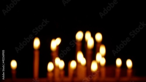 Blured candles flame Isolated on dark Background.