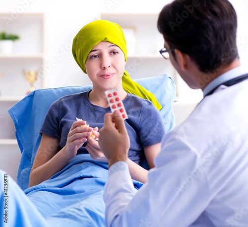 Cancer patient visiting doctor for medical consultation in clini photo