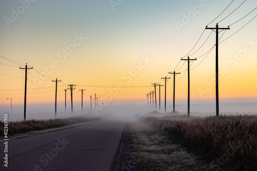Canvastavla Utility poles on road with fog