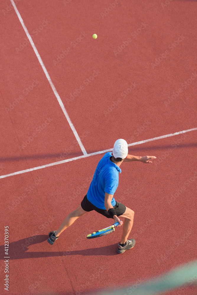 View from above of man playing tennis on slag court View from above of man playing tennis on slag court