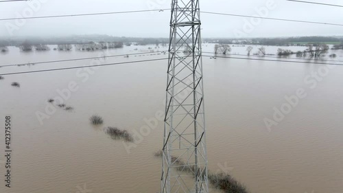 An Electricity Pylon in Deep Water in a Floodwaters Causing Power Outages 