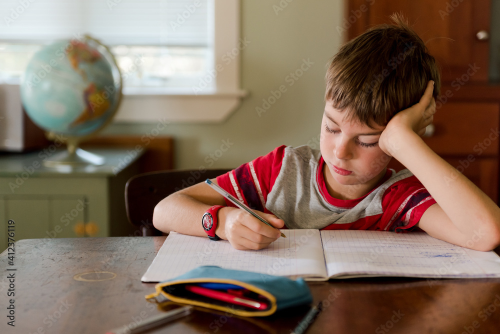 little boy doing his homework little boy doing his homework