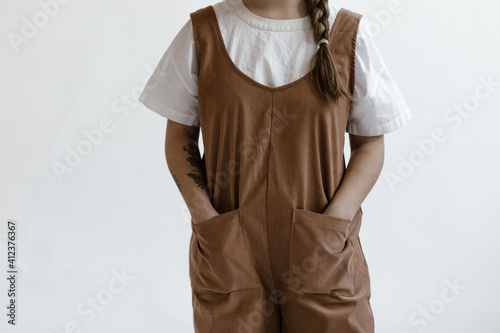 young woman wearing a modern stylish jumpsuit photo