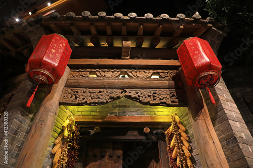 Traditional Chinese woodcarving crafts on the gate of a farmyard, Hebei Province, China