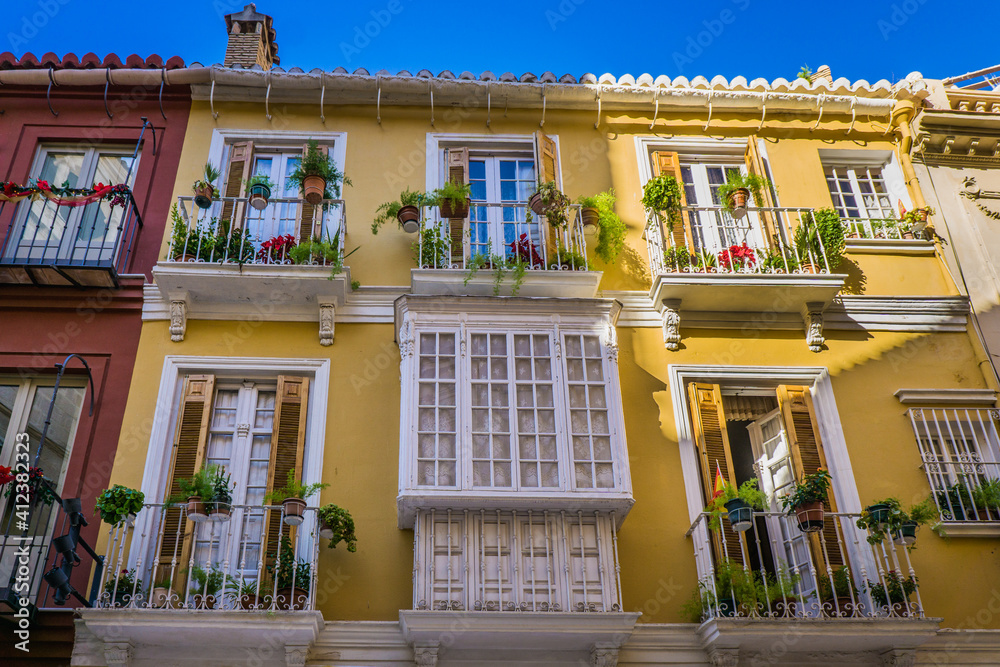 Typical facades in the historic center of Malaga, a city located in Andalucia, spain Typical facades in the historic center of Malaga, a city located in Andalucia, spain