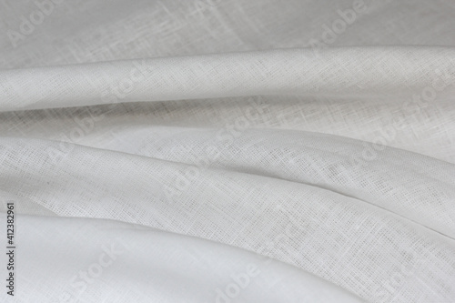 Softened bleached linen sheet folded.