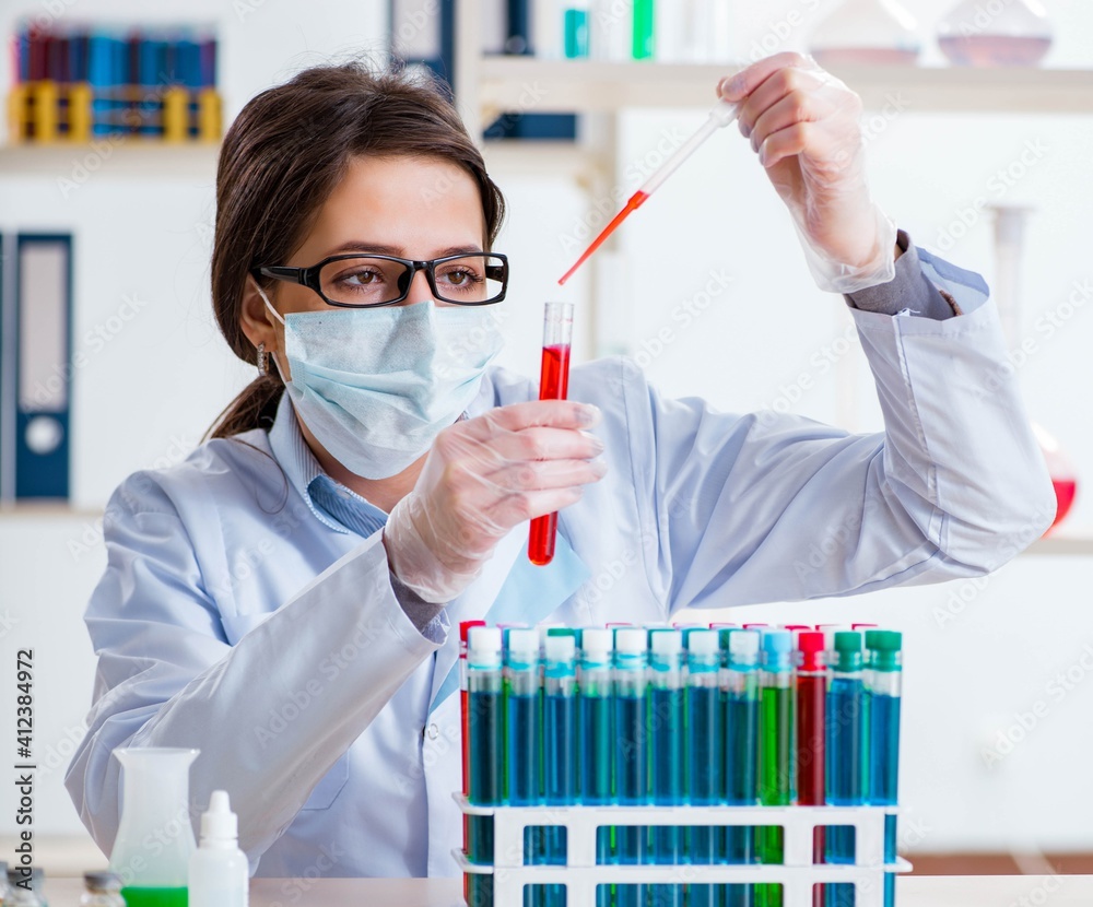 Female chemist working in hospital lab Female chemist working in hospital lab