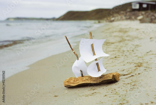 Miniature bark boat on beach