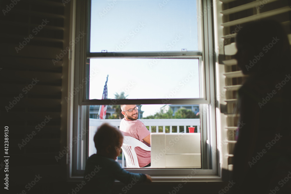 Dad watching son through window Dad watching son through window
