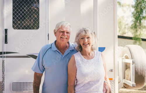 grey nomads, happy retirees with their caravan photo