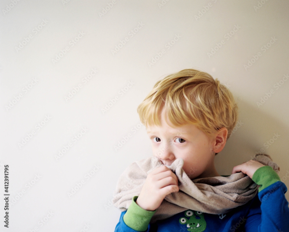 cute little boy snuggling with his blankie cute little boy snuggling with his blankie