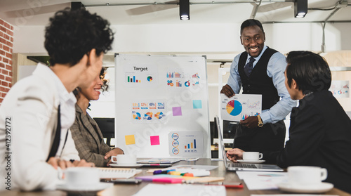 African Americans Smiling and cheerful are leading graph business meetings with people of diversity nationalities in office conference rooms. Concept Diversity meeting business room.